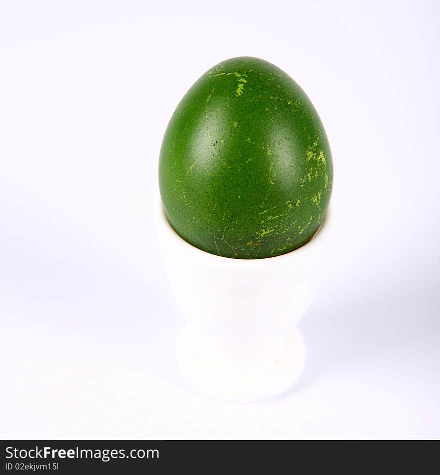 Green chicken eggs in egg holder