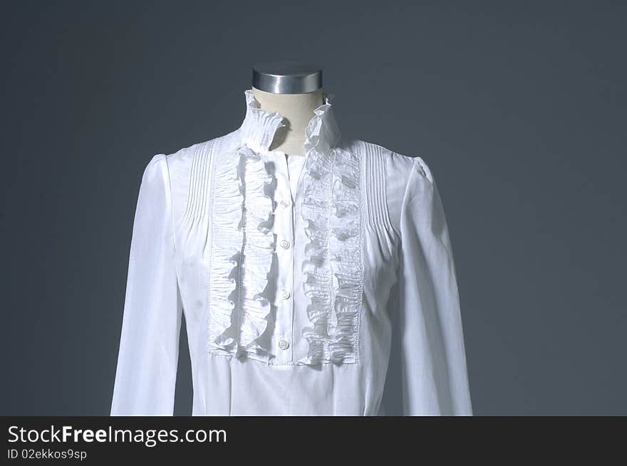 Woman shirt on mannequin on light background