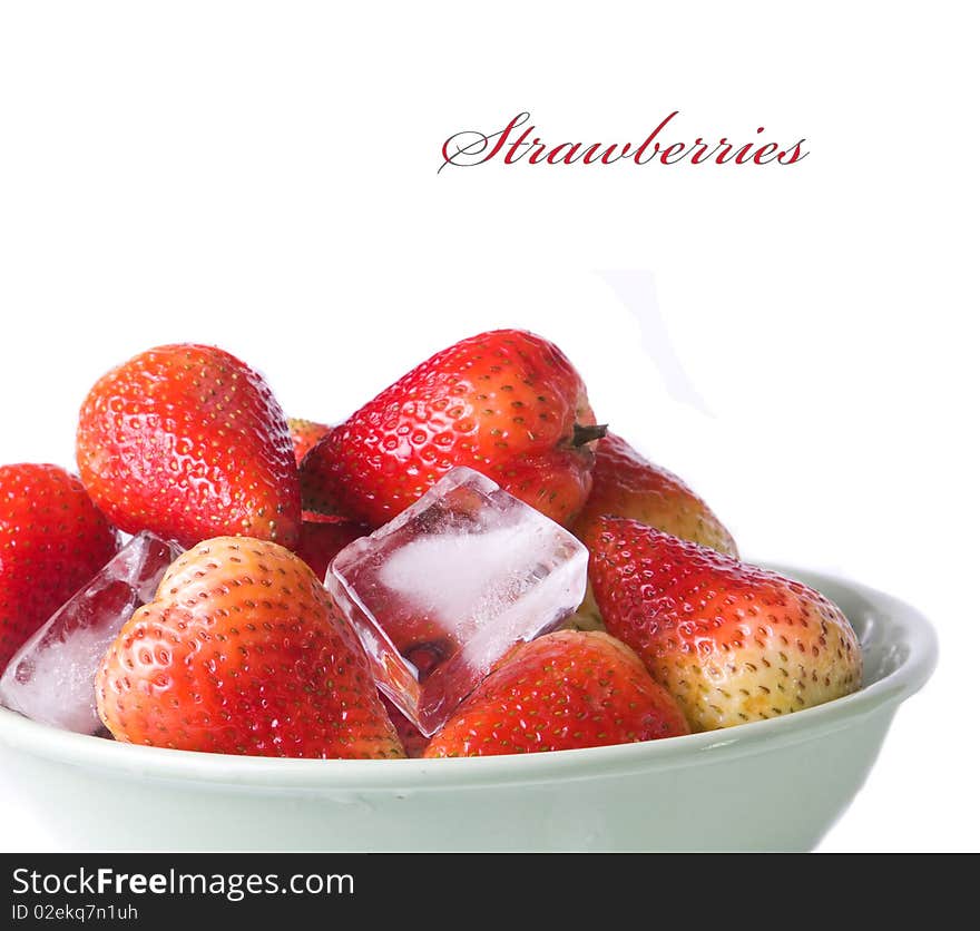 Ice cubes and strawberries on white background