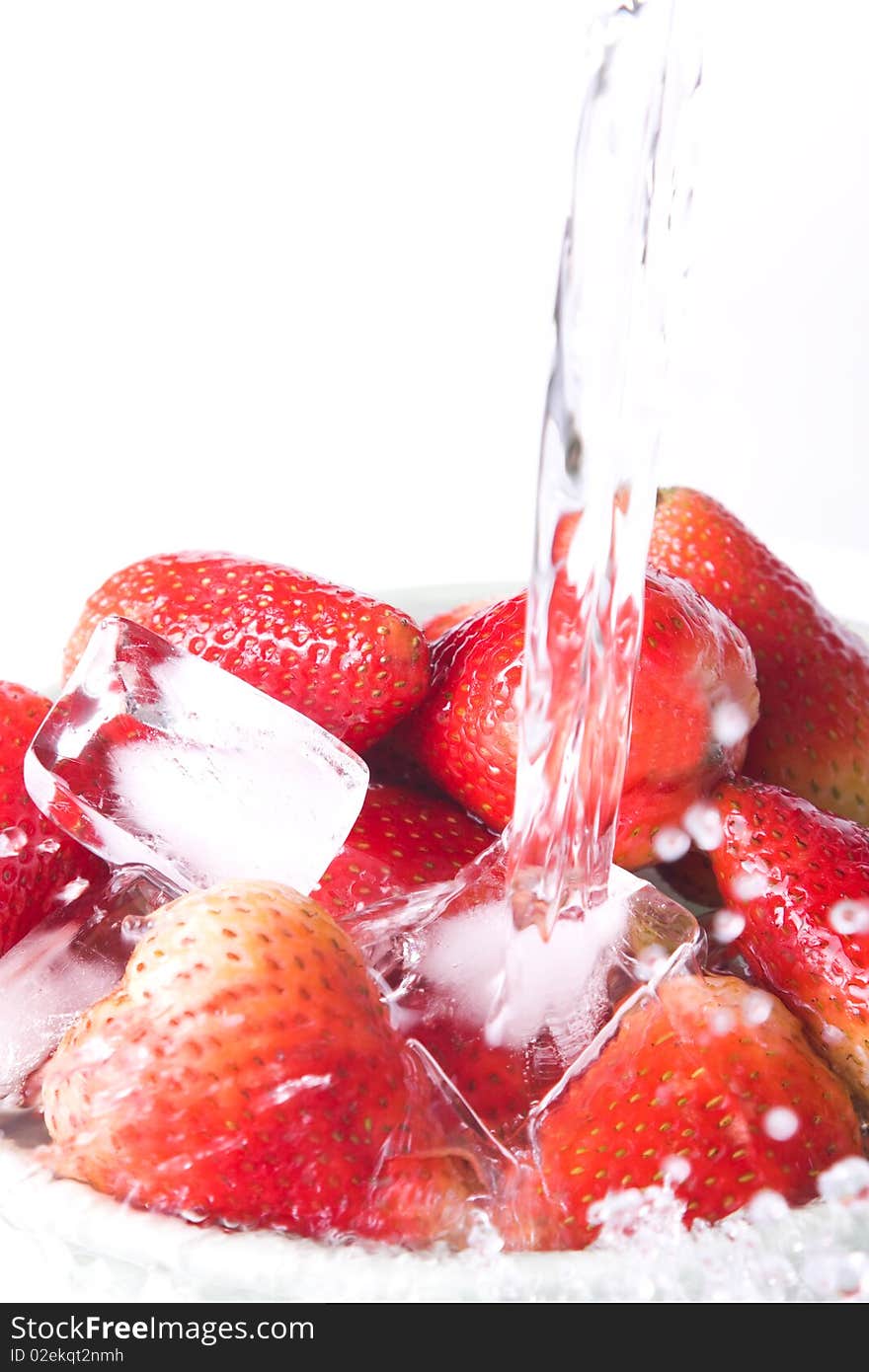 Water and strawberries on white background