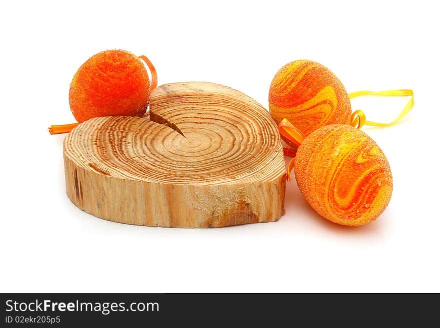 Easter eggs and a wooden heart on a white background