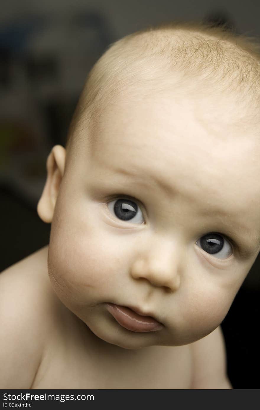 Baby shot in studio looking into camera. Baby shot in studio looking into camera