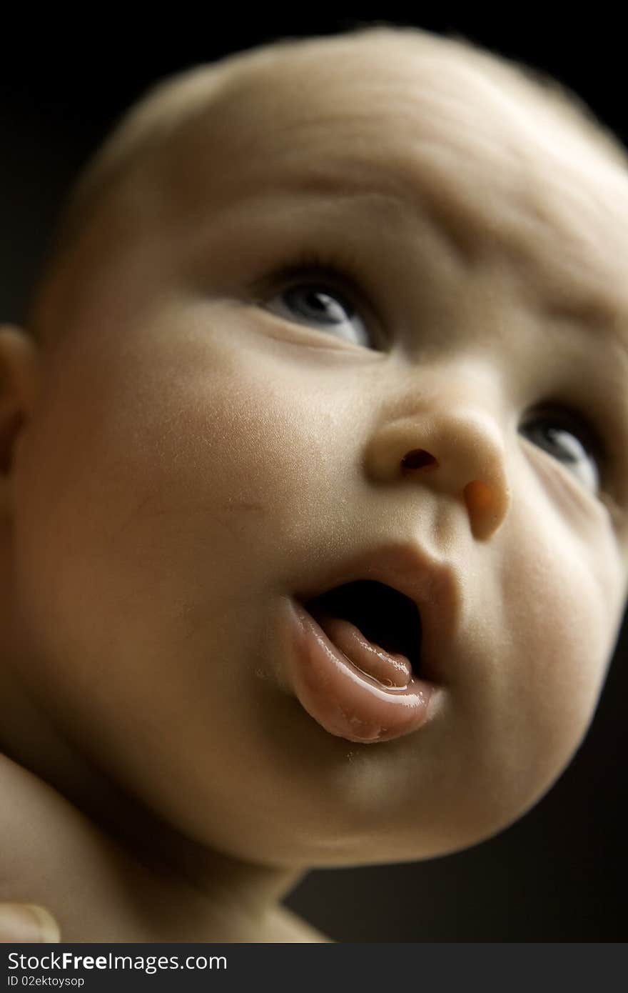 Baby shot in studio with funny expression. Baby shot in studio with funny expression