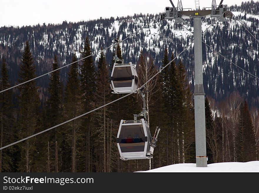 Gondola ski lift on the alpine skiing track. Gondola ski lift on the alpine skiing track