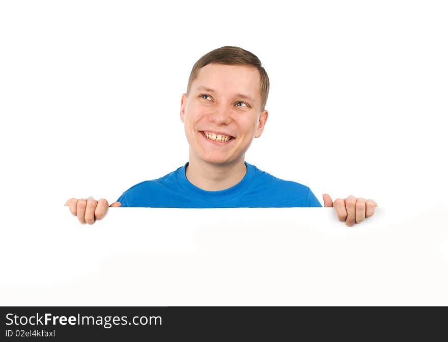 Young man looking over a blank board