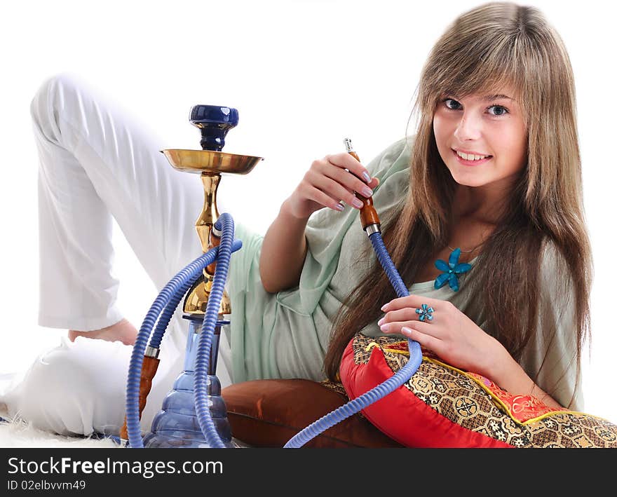 The young beautiful girl with a fair hair in a grey dress separately on a white background