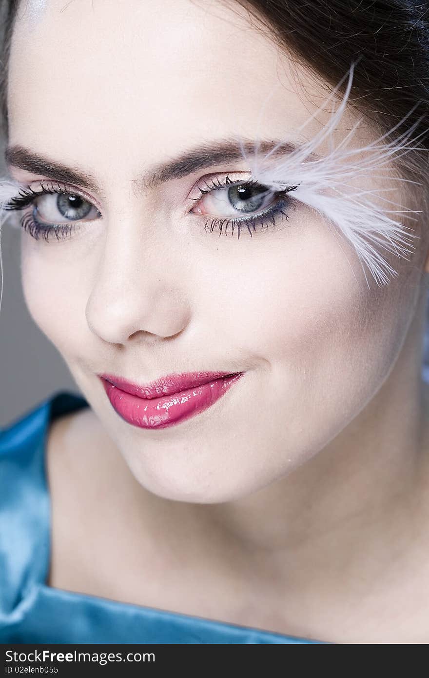 Portrait of young pretty smiling woman with long white eyelashes. Portrait of young pretty smiling woman with long white eyelashes