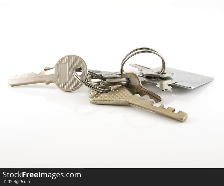 Bunch of old keys on the white background.