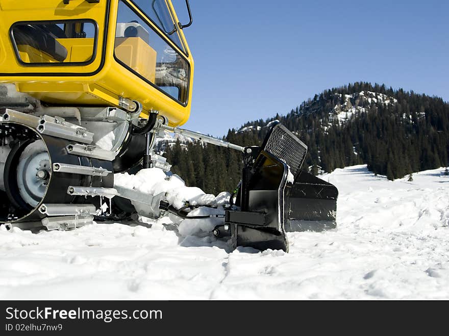 Yellow snoblower in italian alps. Yellow snoblower in italian alps