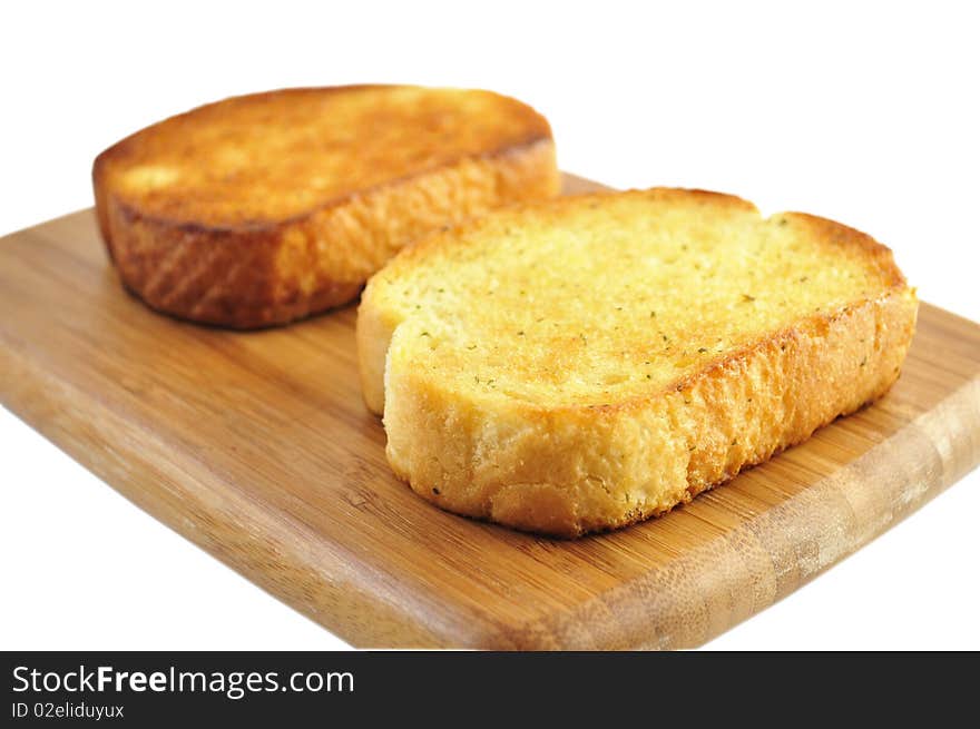 Garlic toasts on a cutting board