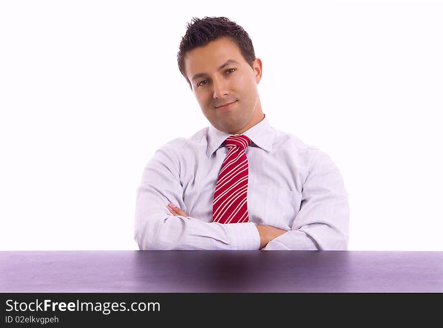 Young business man on a desk, isolated on white background. Young business man on a desk, isolated on white background