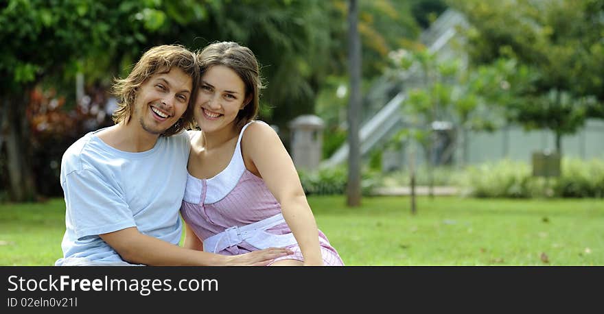 Couple are very happy together in the park. Couple are very happy together in the park