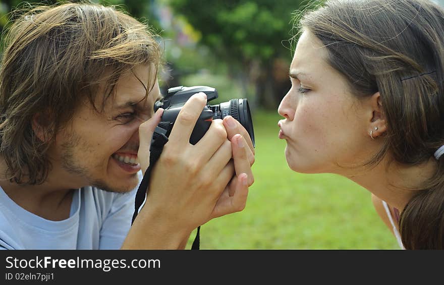 Gorgeous couple take pictures in the park. Gorgeous couple take pictures in the park