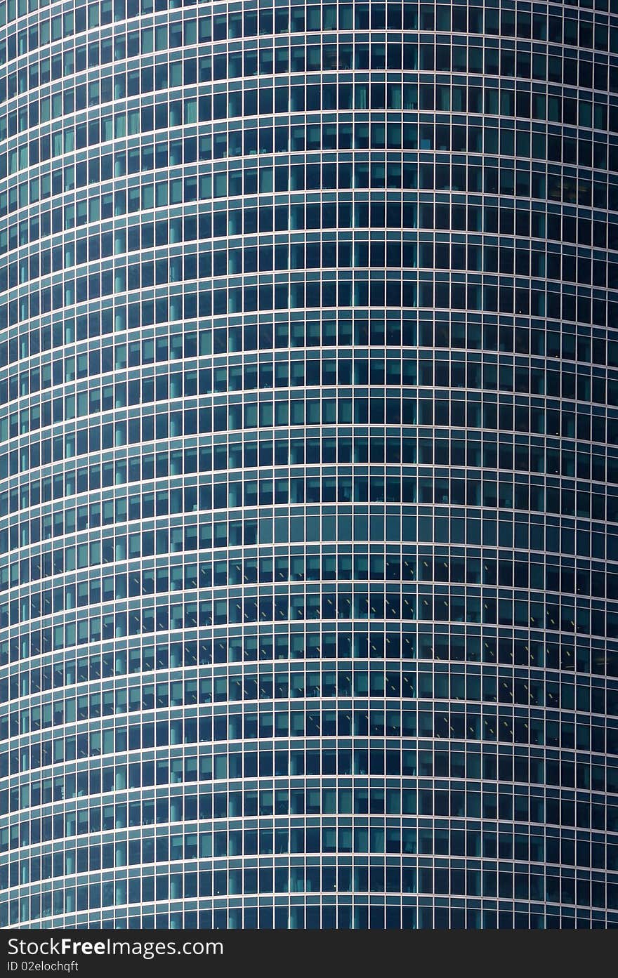 Blue modern office buildings over blue sky