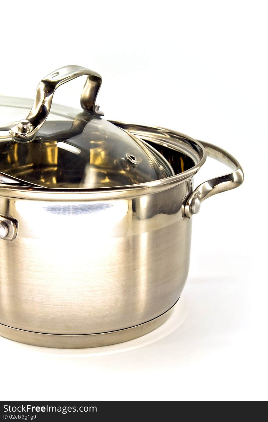 Metallic stew pan against white background