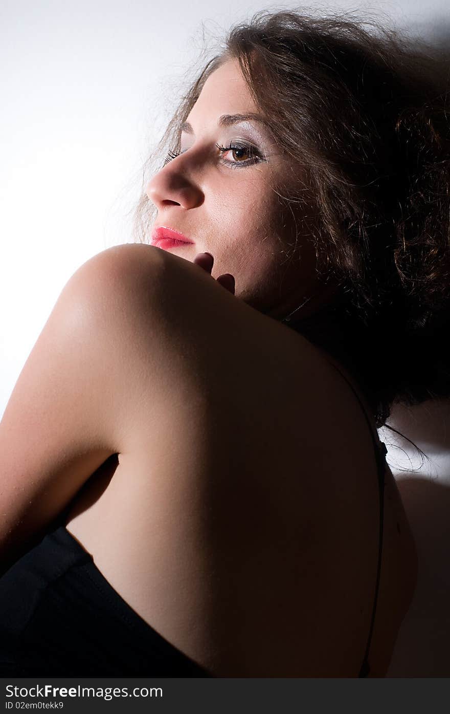 Dramatic portrait of grave and beautiful young woman. Dramatic portrait of grave and beautiful young woman