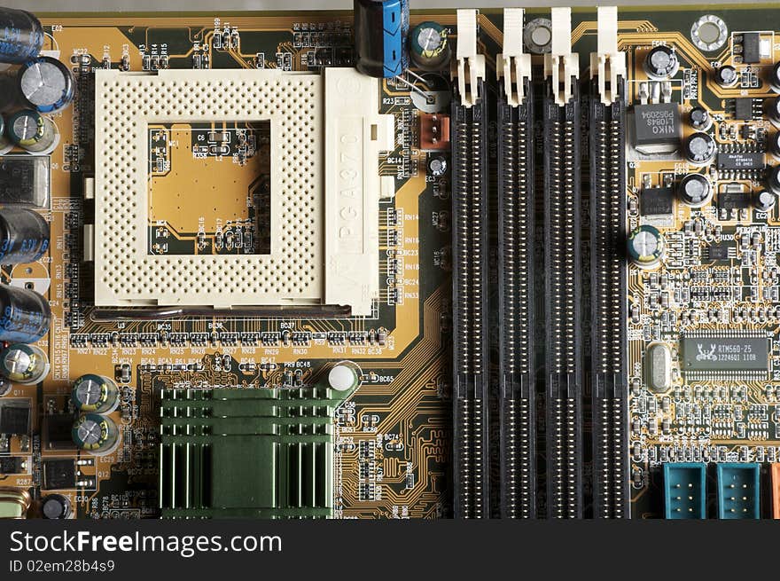 A view of computer motherboard with Memory and CPU plugs. A view of computer motherboard with Memory and CPU plugs