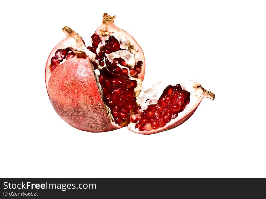 Ripe pomegranate - for immunity strengthening. On a white background. Ripe pomegranate - for immunity strengthening. On a white background