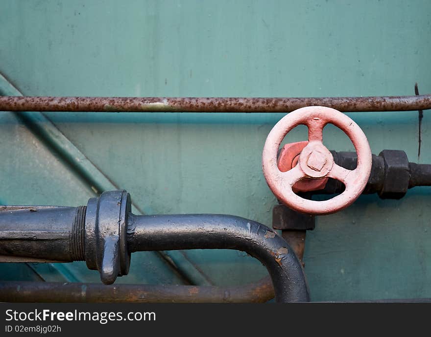 Old Water Valve Against a metal Background