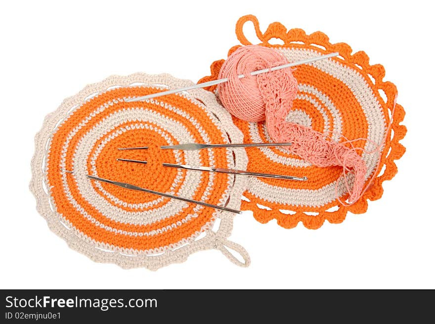 Knitted orange napkins and hooks. Knitted orange napkins and hooks