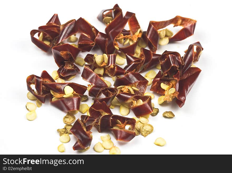 Sun-dried chili pepper isolated on white, macro lens used. Sun-dried chili pepper isolated on white, macro lens used.