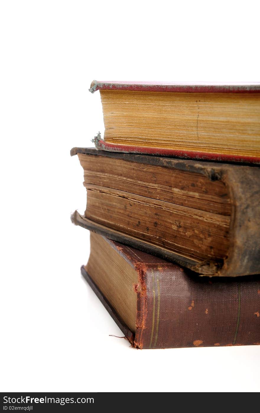 Vintage books in a pile isolated over white background