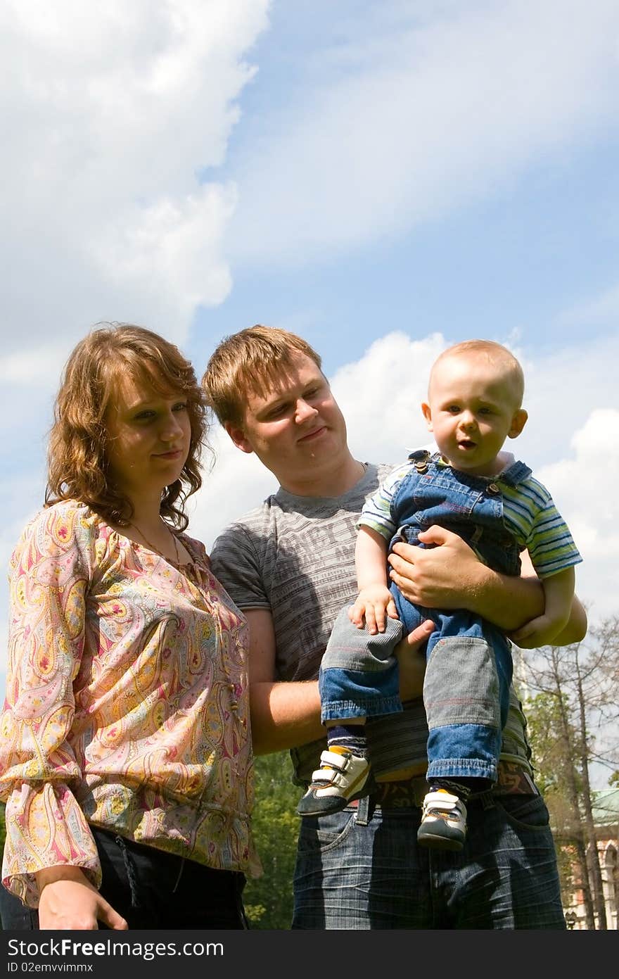 Happy family with son walking outdoors