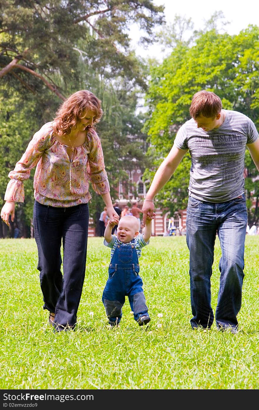 Happy family with son walking outdoors