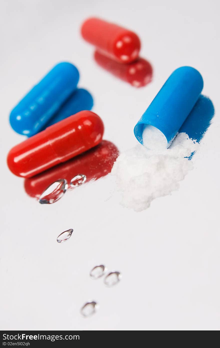 Red and blue tablets.Closeup background