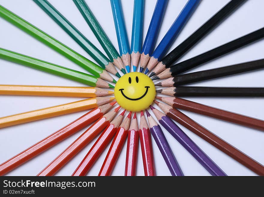 Assortment of colored pencils with shadow on white background - colored crayons