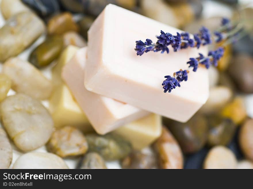 Natural soaps with lavander flowers on a natural background of stones