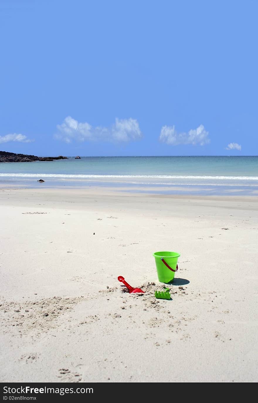 Colourful Beach Toys on a secluded beach