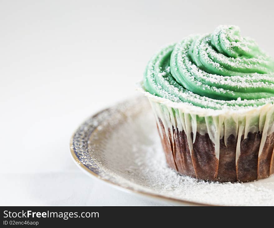 Close-up of a chocolate cupcake with cream cheese topping. Close-up of a chocolate cupcake with cream cheese topping.