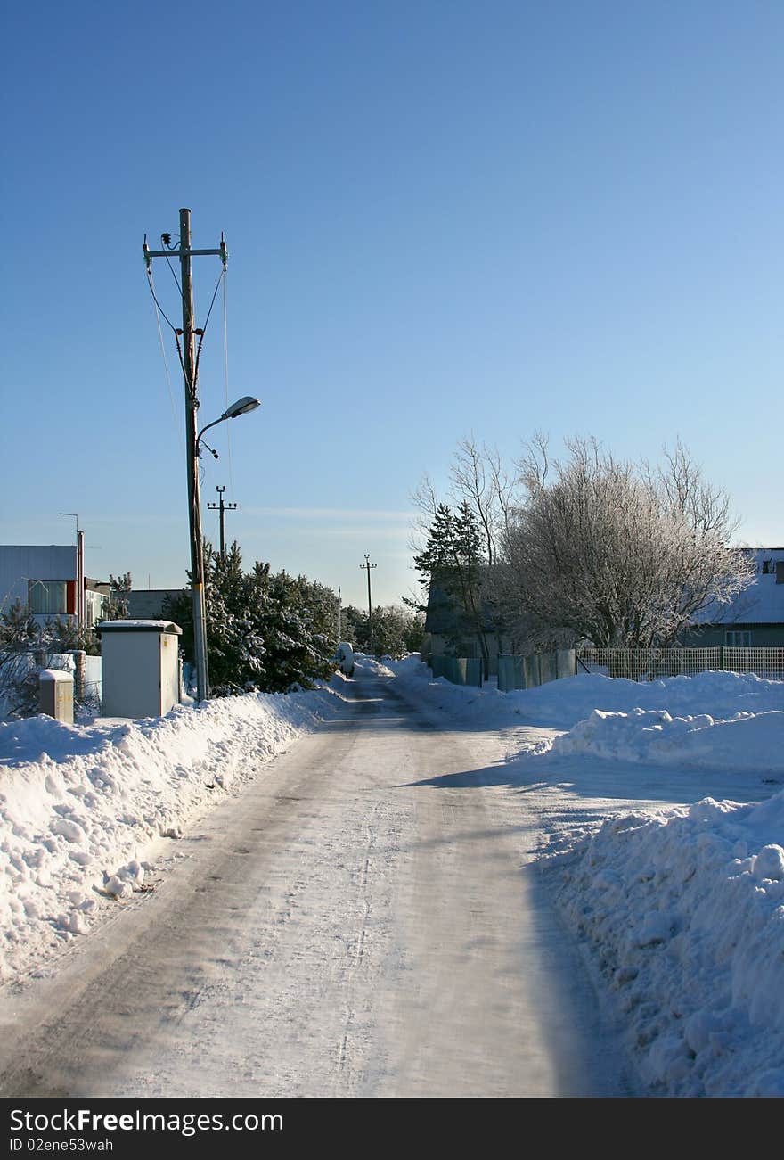 Beautiful empty winter road in a cold sunny day, near city of Tallinn in Estonia. Beautiful empty winter road in a cold sunny day, near city of Tallinn in Estonia