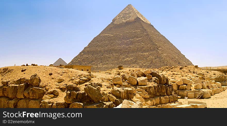Egyptian pyramid on the background of blue sky