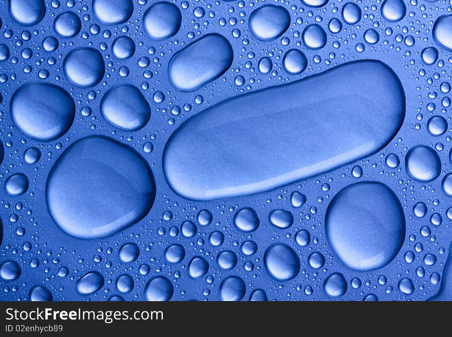 Water drops concept in blue light. abstract background / pattern. Water drops concept in blue light. abstract background / pattern