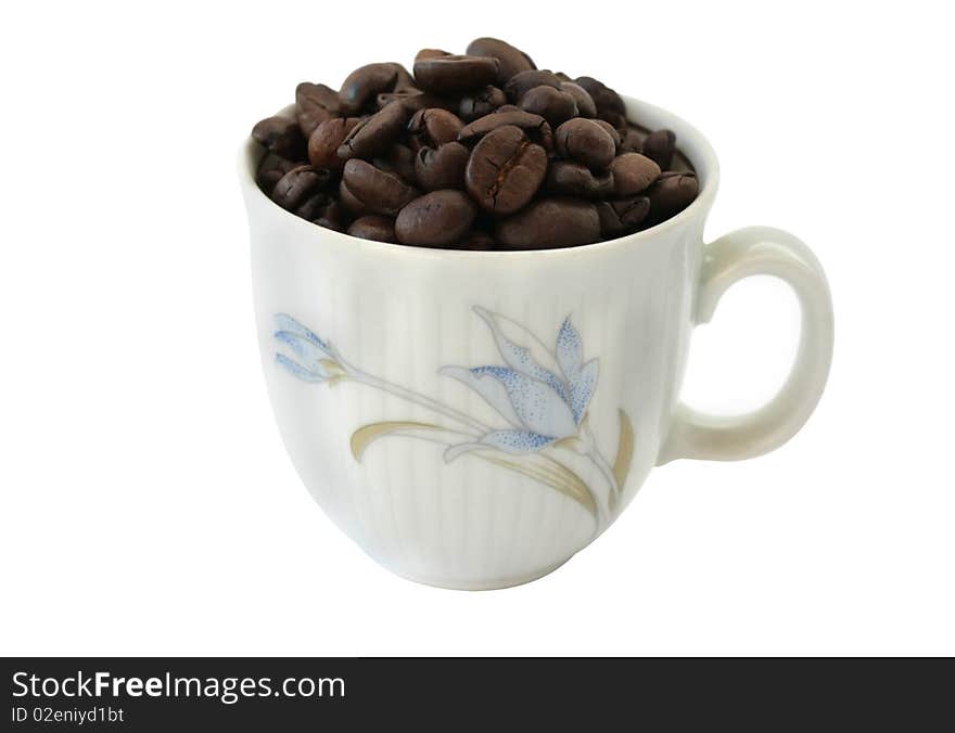 Cup with coffee beans on white background