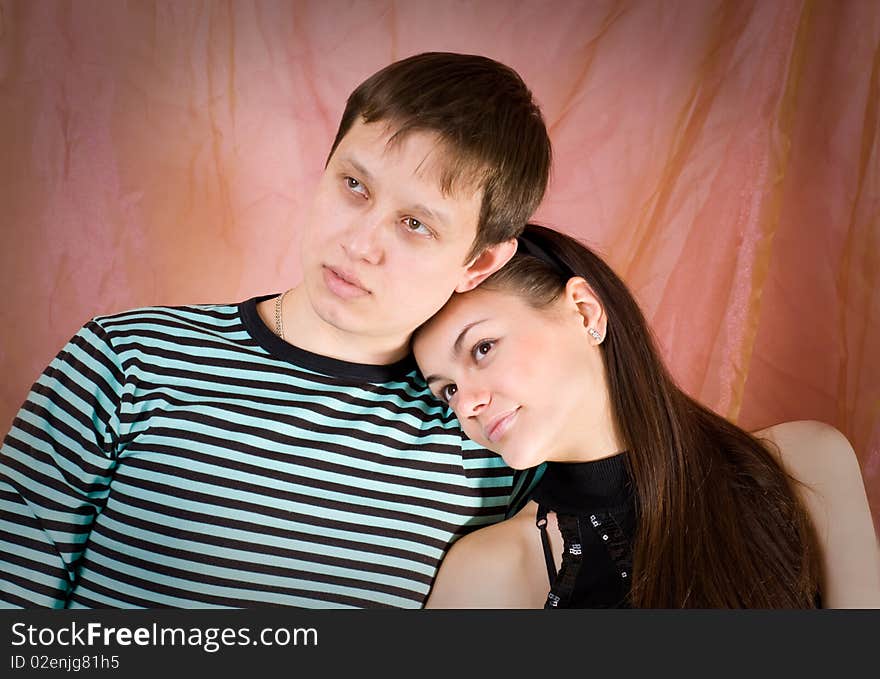 The enamoured couple on a pink background