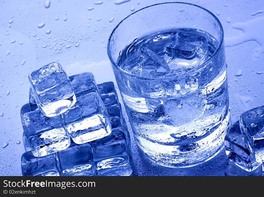 Cold Water And Ice Cubes