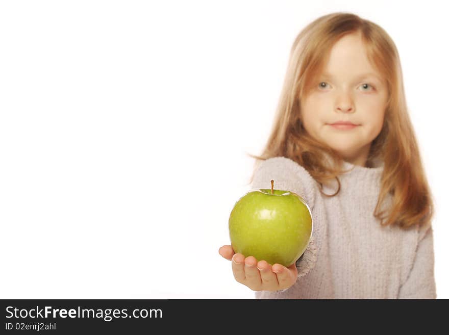 Young girl holding an apple on an isolated background