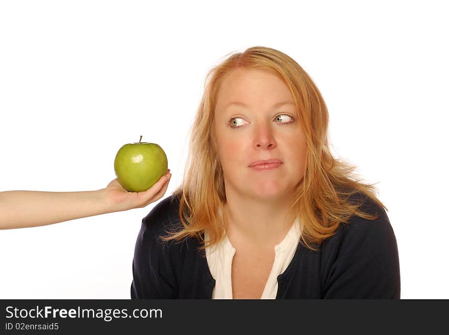 Woman looking at an apple on an isolated background