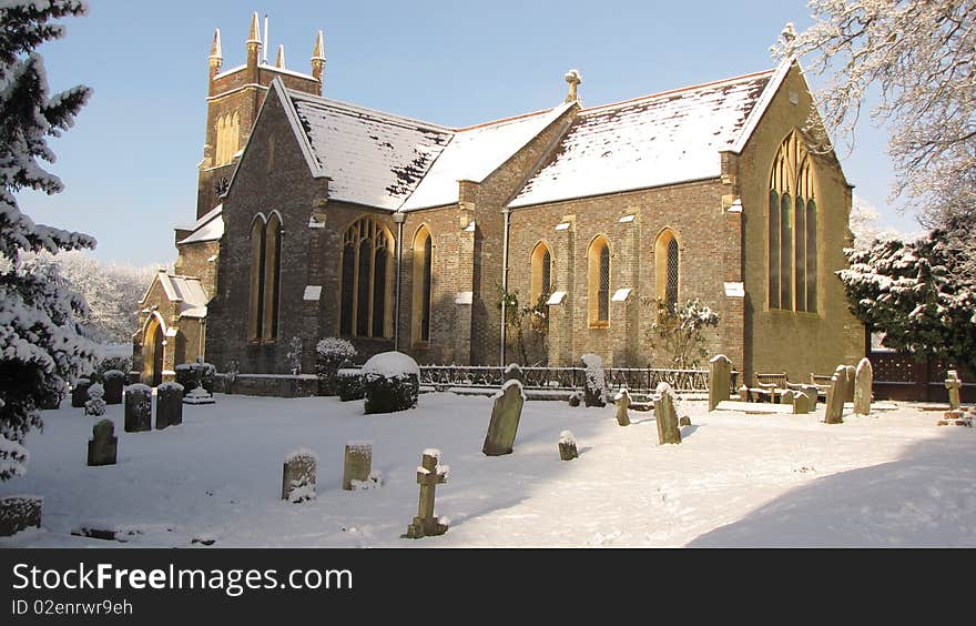 A english church covered in snow. A english church covered in snow