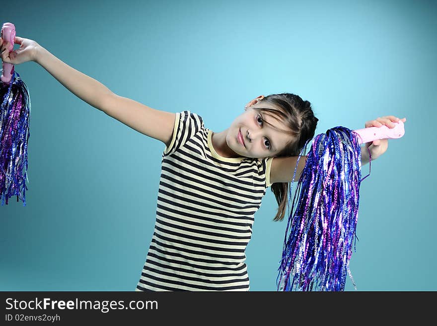 Little girl learning to dance, turquoise background. Little girl learning to dance, turquoise background