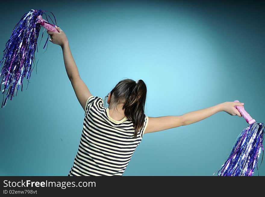 Little girl learning to dance, turquoise background. Little girl learning to dance, turquoise background