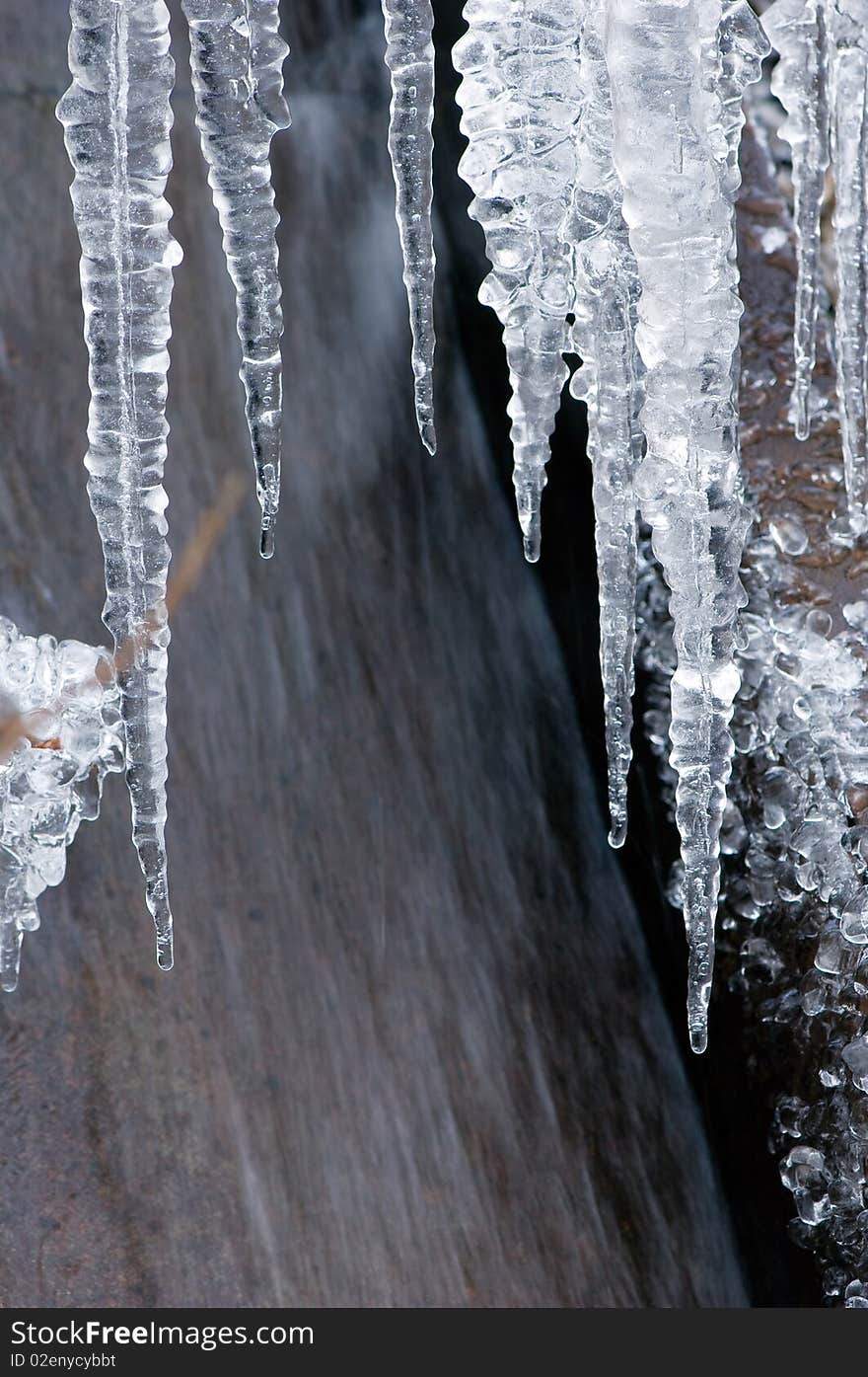 Icicles isolated on a grey background