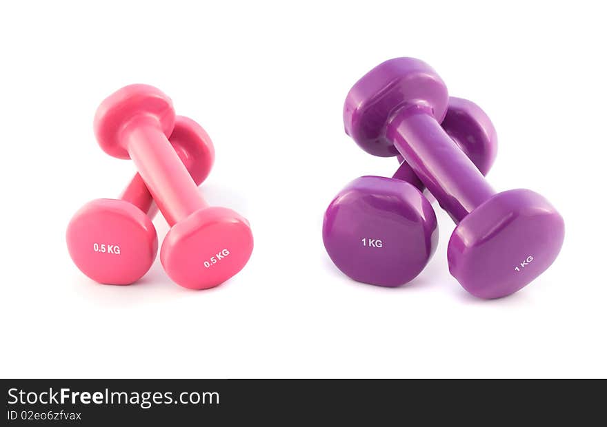 Violet and pink dumbbells on white background