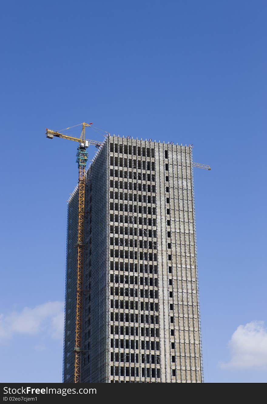 Construction of a high building with blue sky.in China.