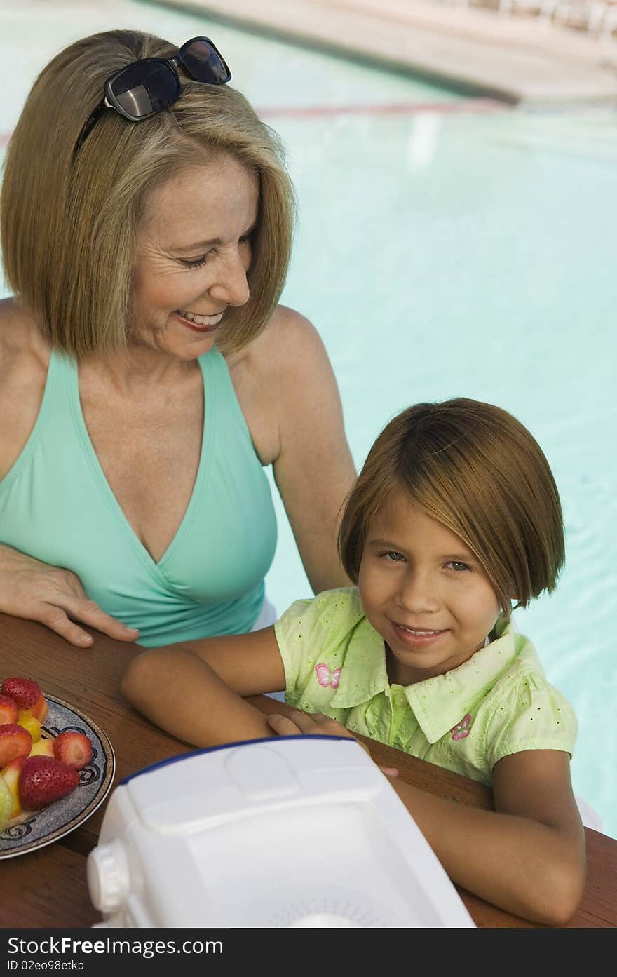 Girl with grandmother at pool