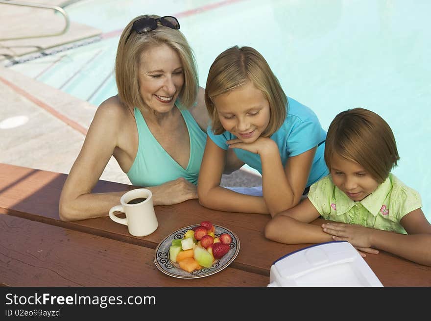 Girls and Grandmother watching tv