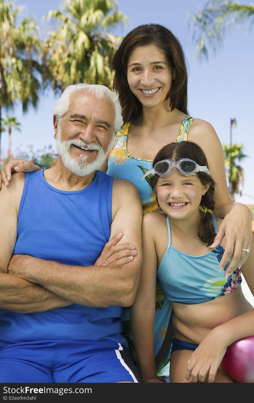 Girl (10-12) with mother and grandfather, front view portrait. Girl (10-12) with mother and grandfather, front view portrait.